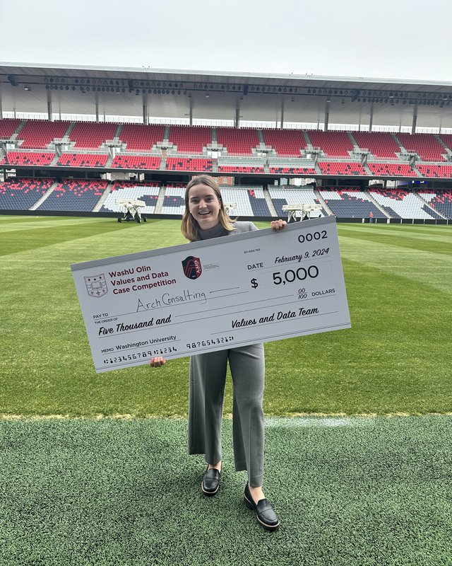 Holding a winning check from the WashU Olin case competition